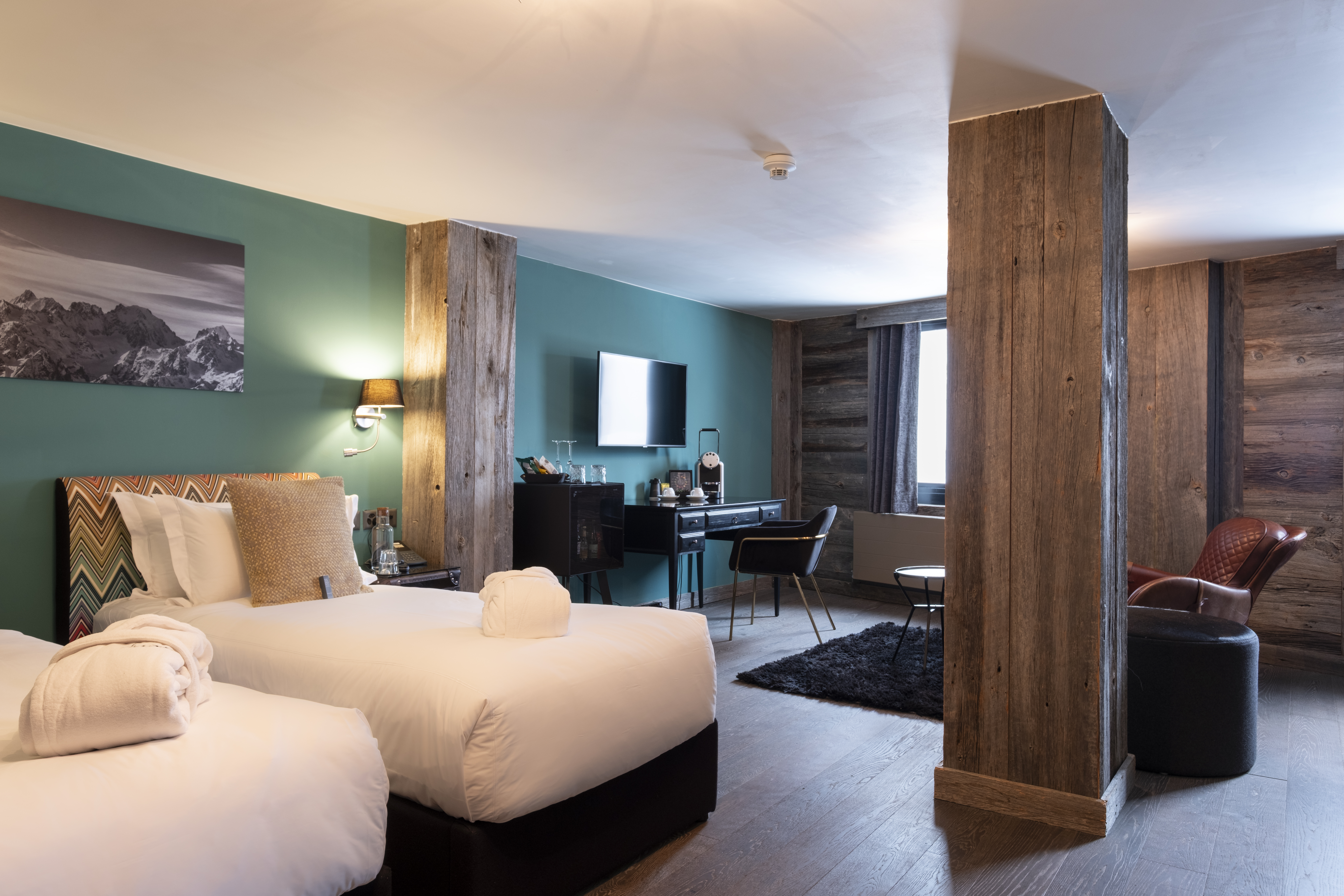 Bed in the superior room at the Hotel Farinet